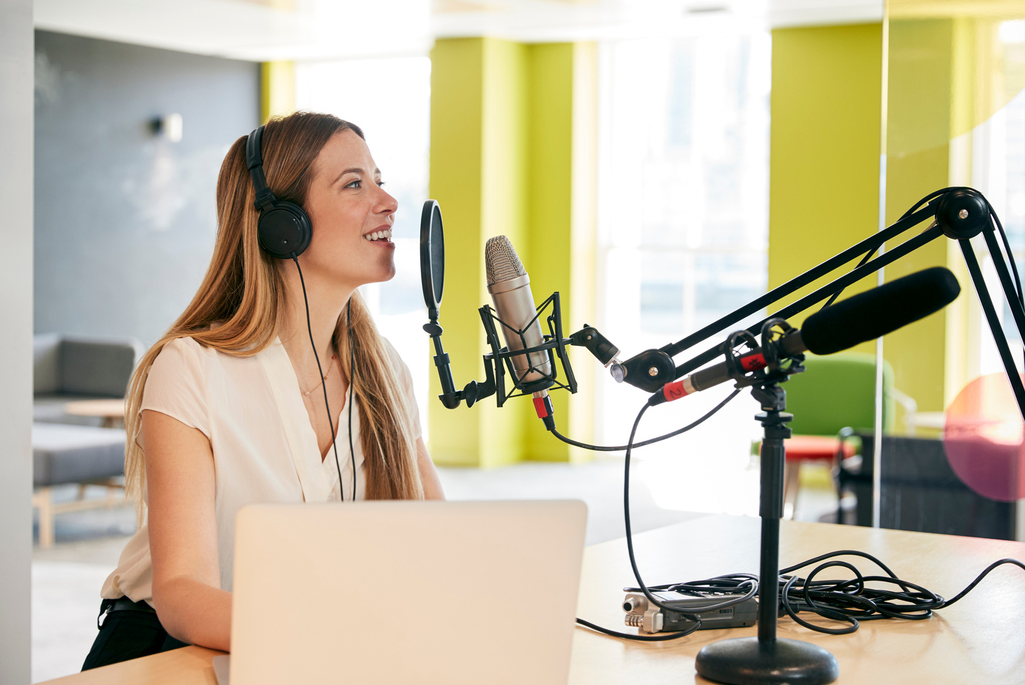 Young Woman Broadcasting in a Studio, Close up